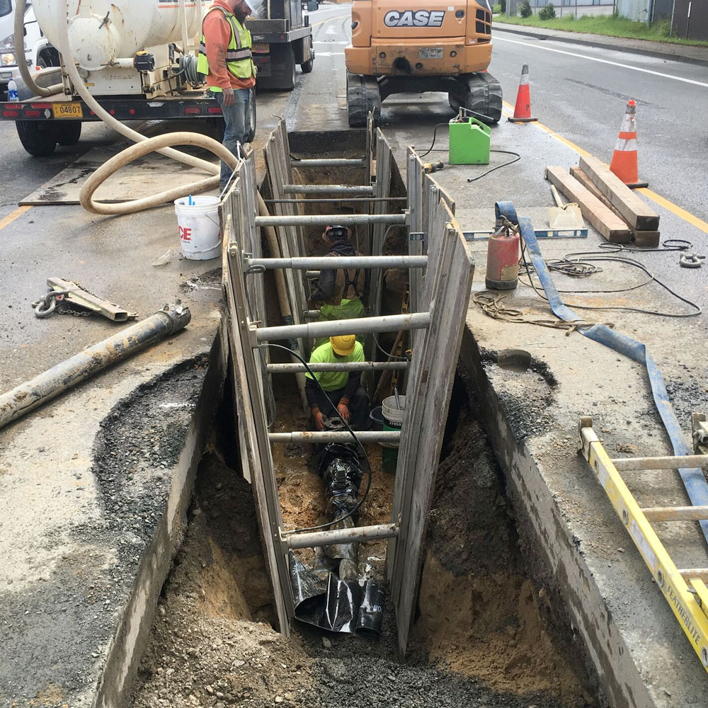 Working in speed shoring for sanitary sewer line install